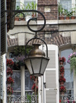 SX19825 Lantern with flowers on balcony in background, Troyes, France.jpg